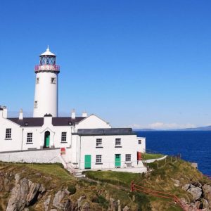 Fanad Lighthouse with sailboat